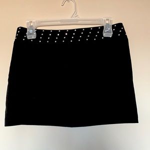 Black short skirt with little sequence details around the waist in size S.